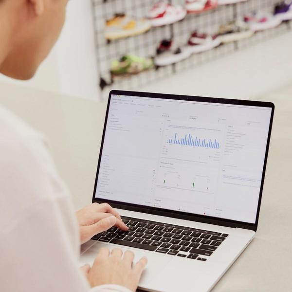 Person using laptop and looking at Seller Hub interface