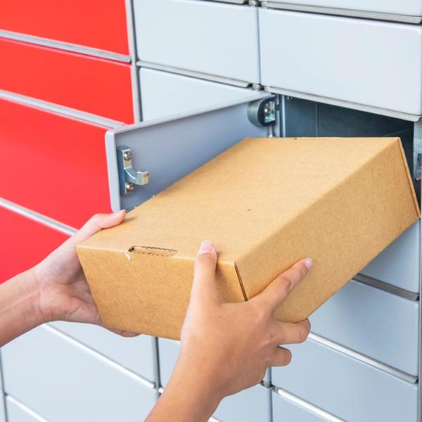 Package being placed in a mail slot