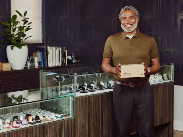 Man standing in front of watches with eBay box