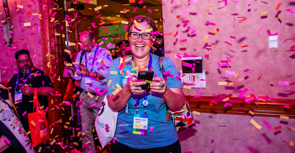 lady attending eBay Open showered by confetti