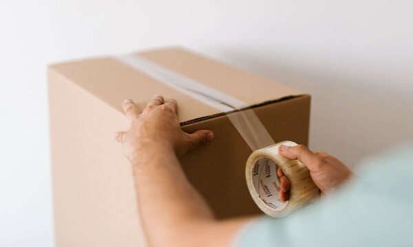 Closing up box with packing tape