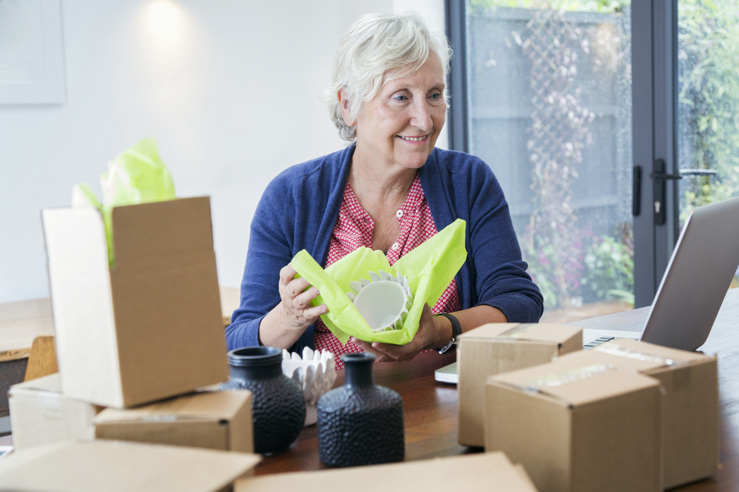 woman packaging dishes