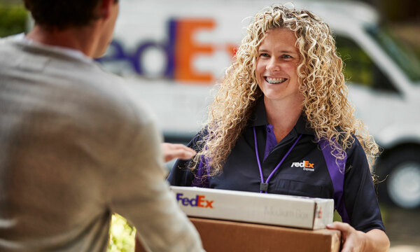 Woman delivering package to a customer