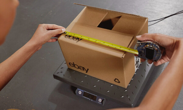 hands measuring eBay box