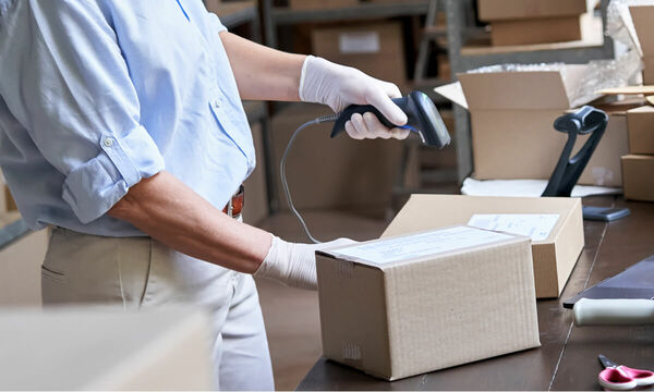 person scanning shipping labels