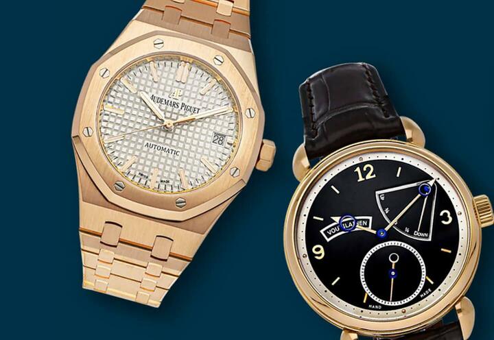 A close up of two gold luxury watches against a dark blue background