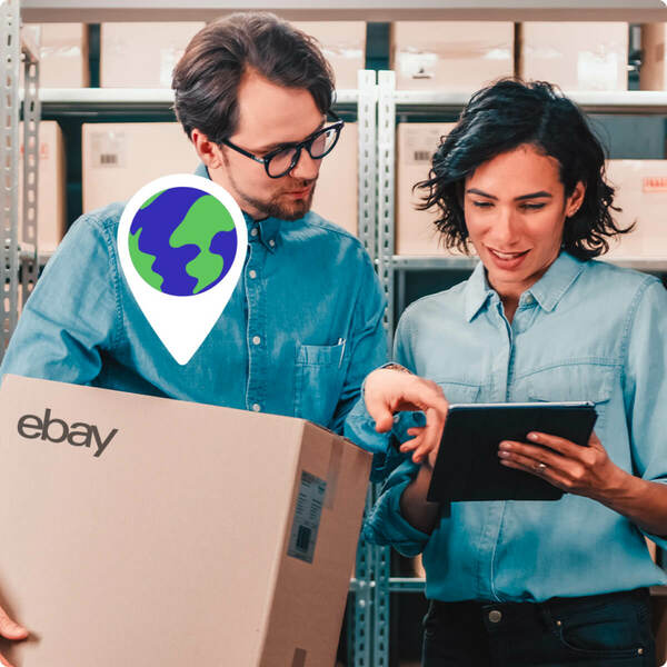 man holding eBay package and woman both looking at a tablet