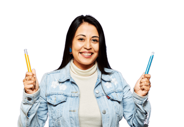 lady wearing denim jacket and holding a yellow pen on her left hand and blue pen on her right hand