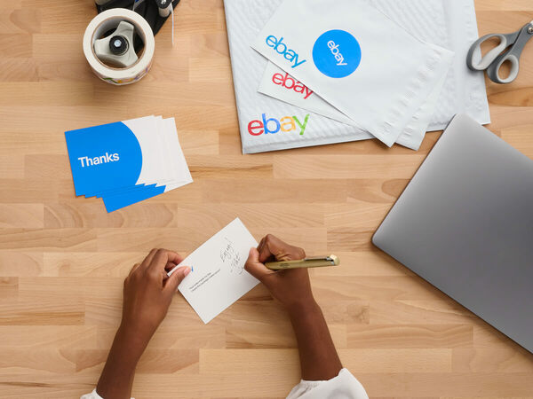 person writing thank you cards