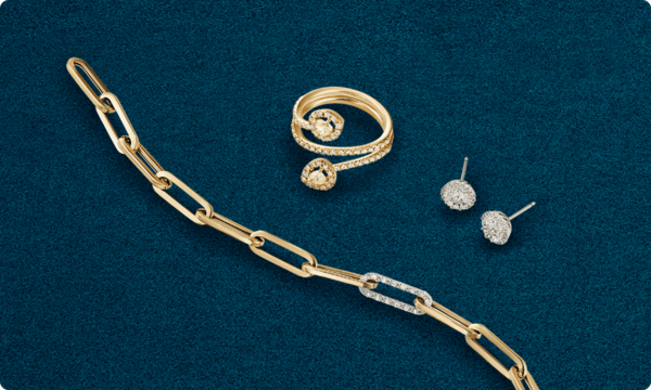 Yellow gold and diamond linked chain bracelet and spiral ring with diamond earrings