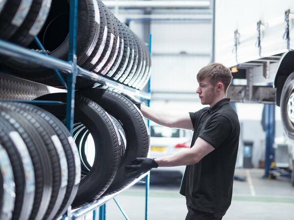 Man holding a tyre