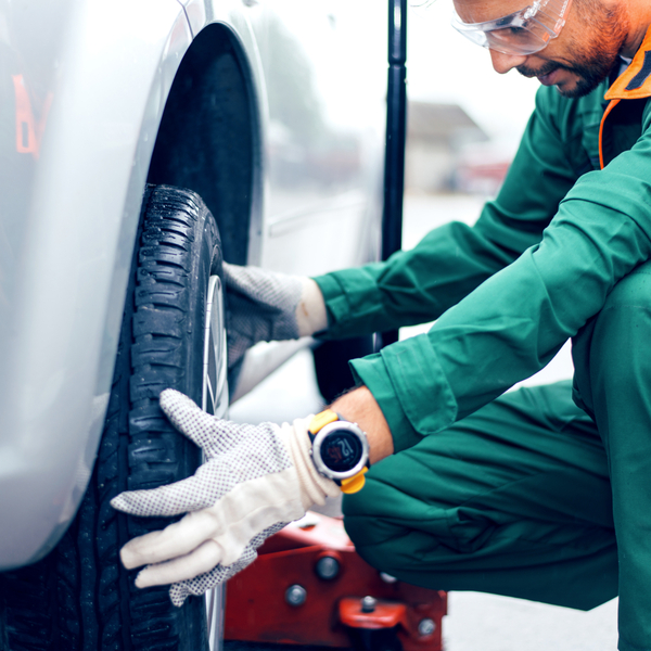 Man fitting a tyre