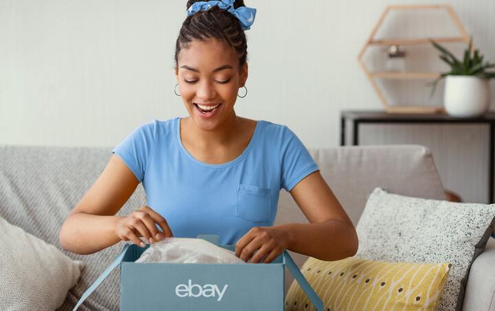 Woman opening parcel