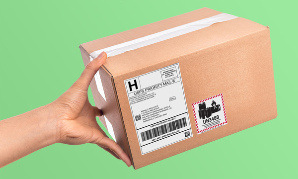 package with eBay shipping label and battery indicator sticker