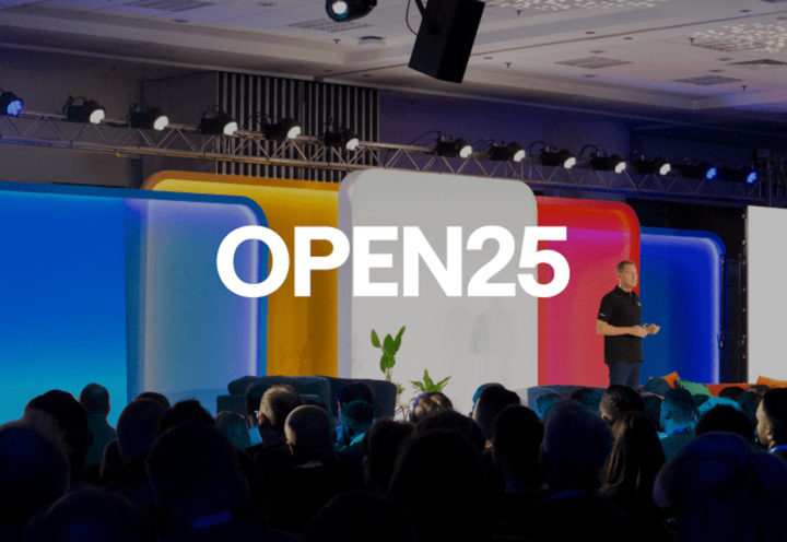 A man presenting on stage to an audience at eBay Open.