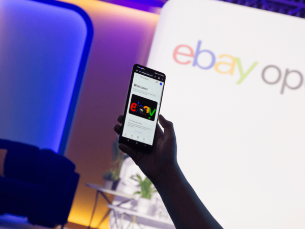 Someone using a mobile phone to view the eBay page.